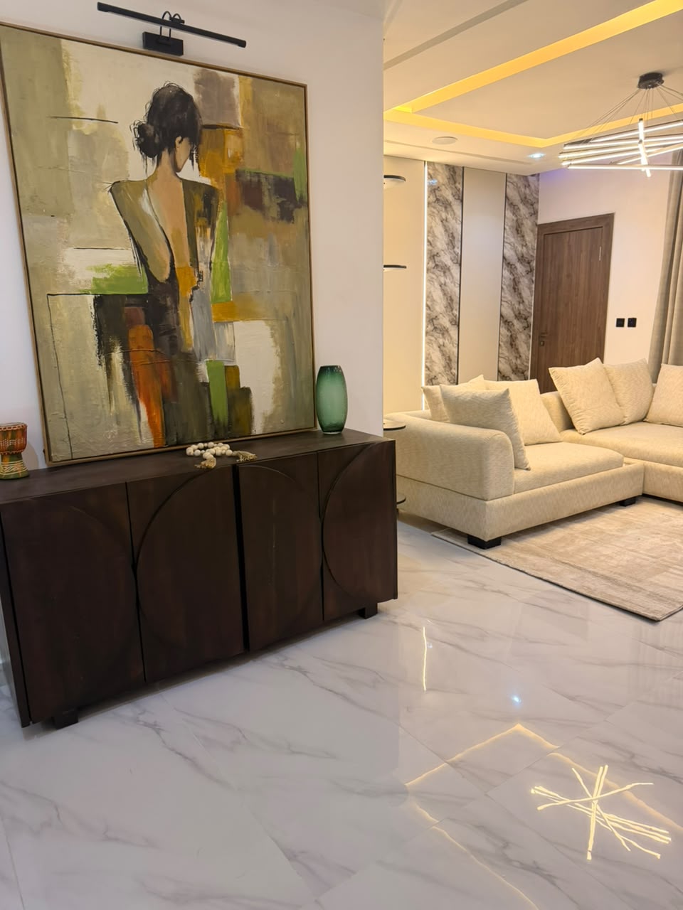 Finished residential living room with warm neutral finishes